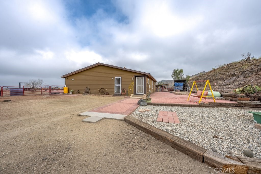 33330 Palen Road Agua Dulce, CA 91390 - Photo 2 of 56 a front view of a house with garden