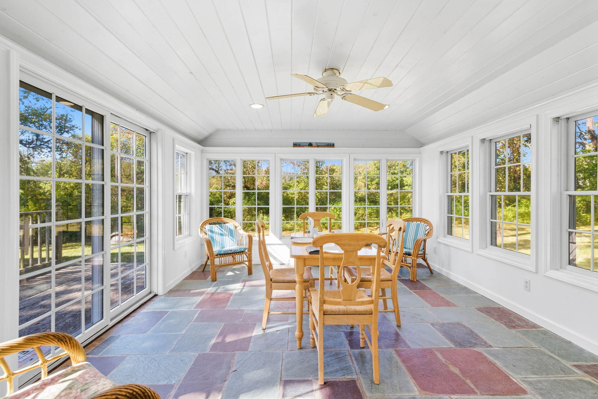 20 Spring Lane Brewster, MA 02631 - Photo 16 of 56 a dining room with furniture a chandelier and a rug