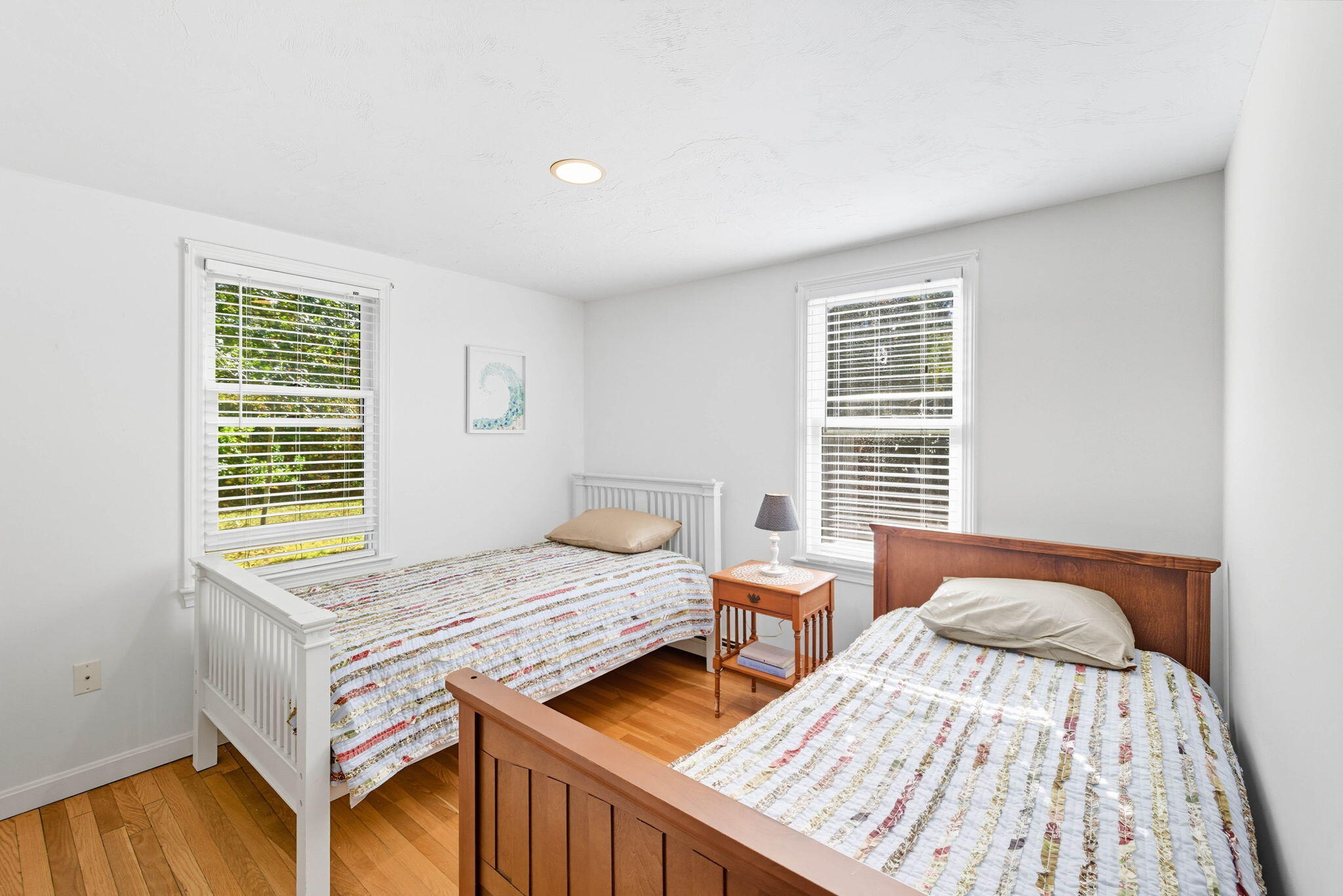 20 Spring Lane Brewster, MA 02631 - Photo 20 of 56 a bed sitting in a bedroom next to a window