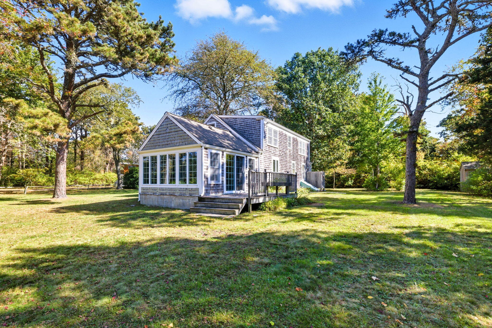 20 Spring Lane Brewster, MA 02631 - Photo 35 of 56 a view of house with garden and trees