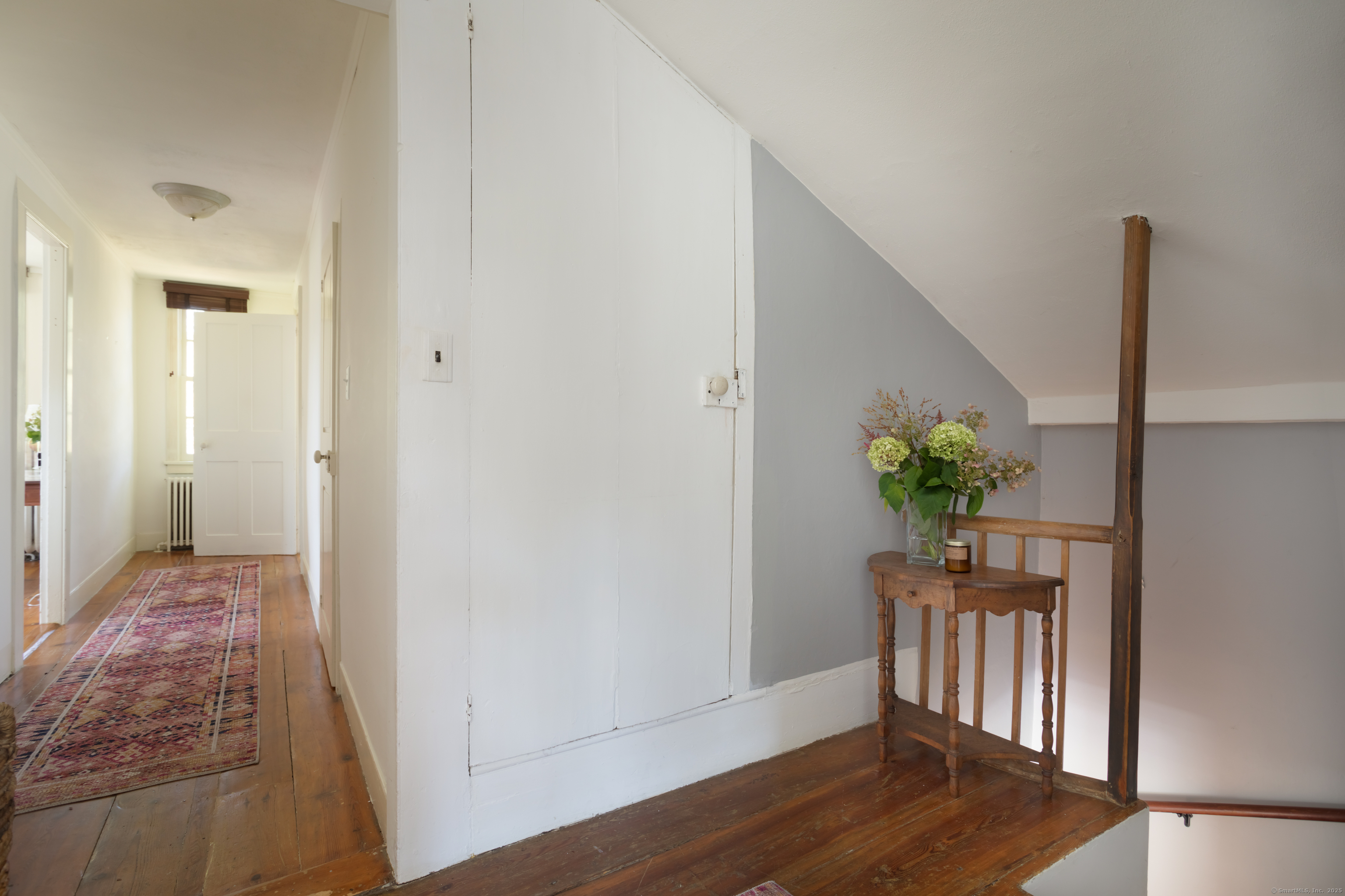 30 Indian Mountain Road Lakeville, CT 06039 - Photo 12 of 17 a view of a hallway to room with wooden floor