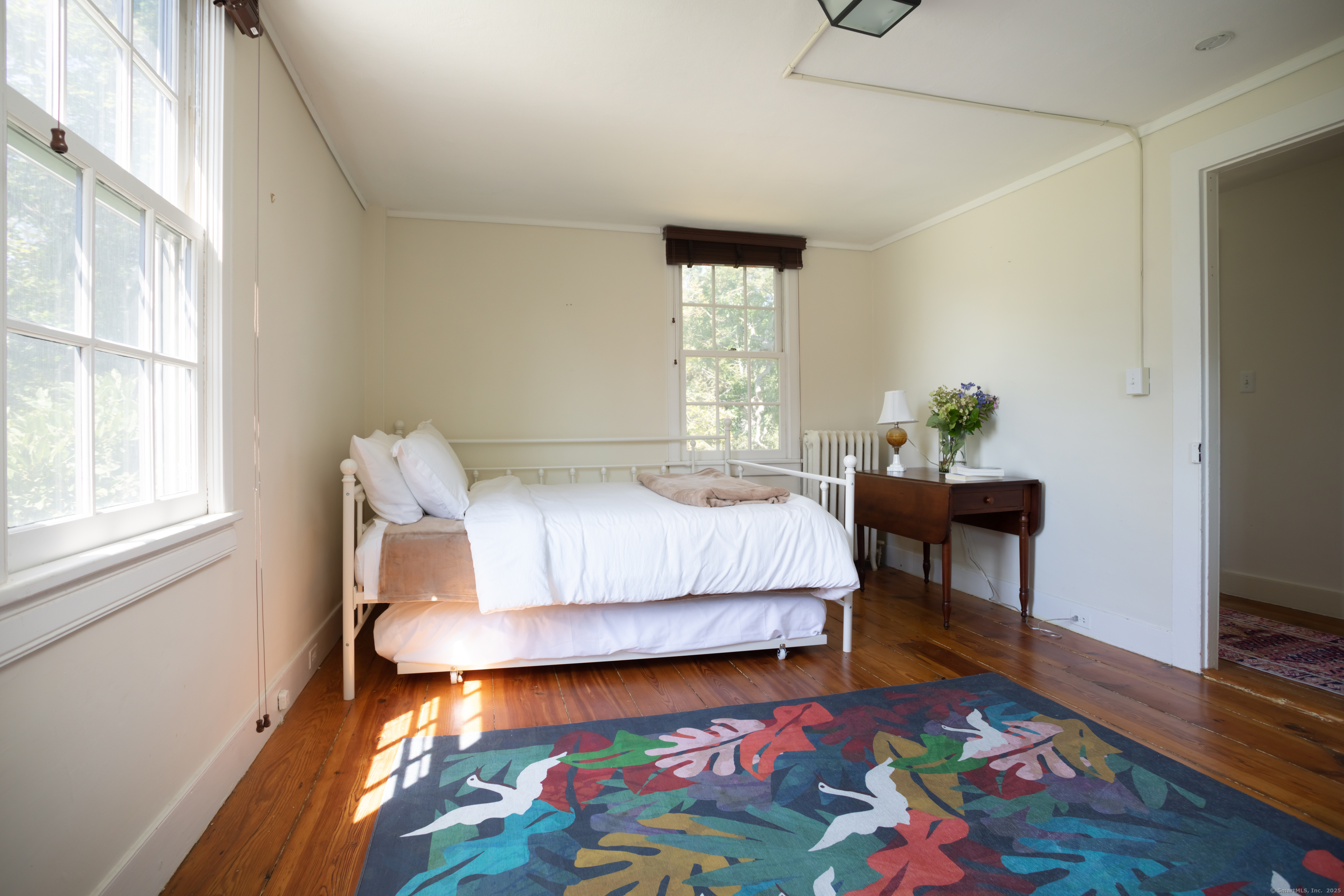 30 Indian Mountain Road Lakeville, CT 06039 - Photo 14 of 17 a bedroom with a bed table and a window