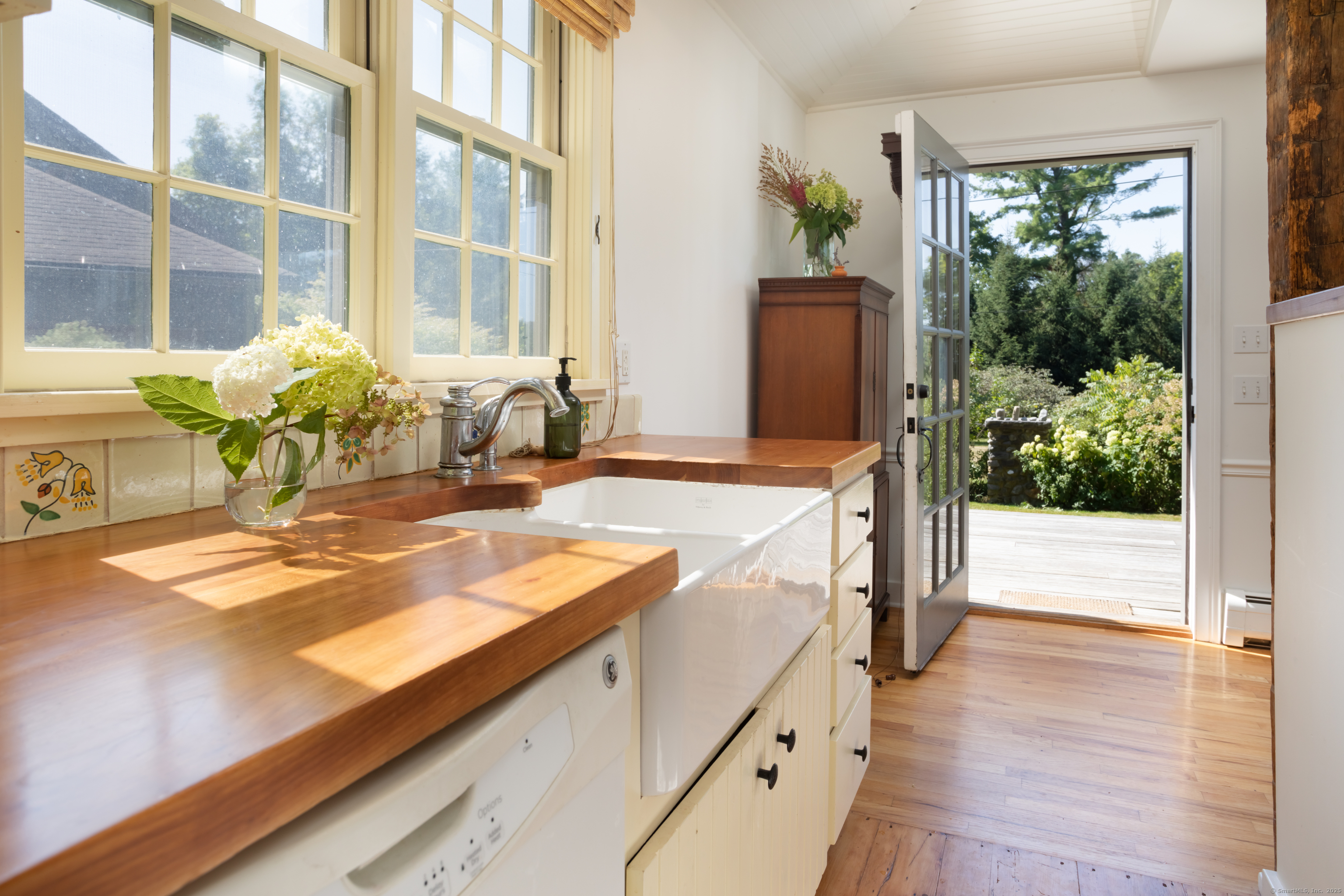 30 Indian Mountain Road Lakeville, CT 06039 - Photo 4 of 17 a view of a kitchen with kitchen island a sink and a large window