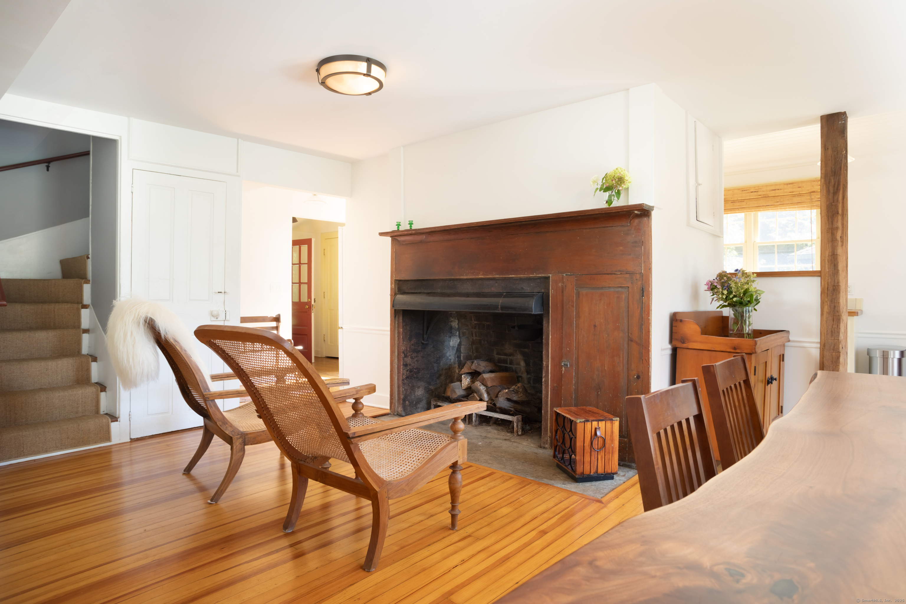 30 Indian Mountain Road Lakeville, CT 06039 - Photo 8 of 17 a view of a livingroom with furniture and a fireplace