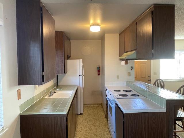 4200 Diamond Street, Unit 4 Capitola, CA 95010 - Photo 2 of 19 a bathroom with a sink double vanity granite and a mirror