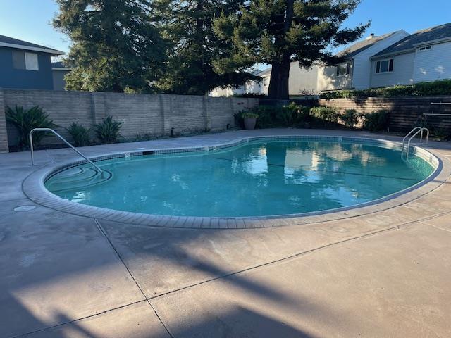 4200 Diamond Street, Unit 4 Capitola, CA 95010 - Photo 5 of 19 a view of a swimming pool with a patio