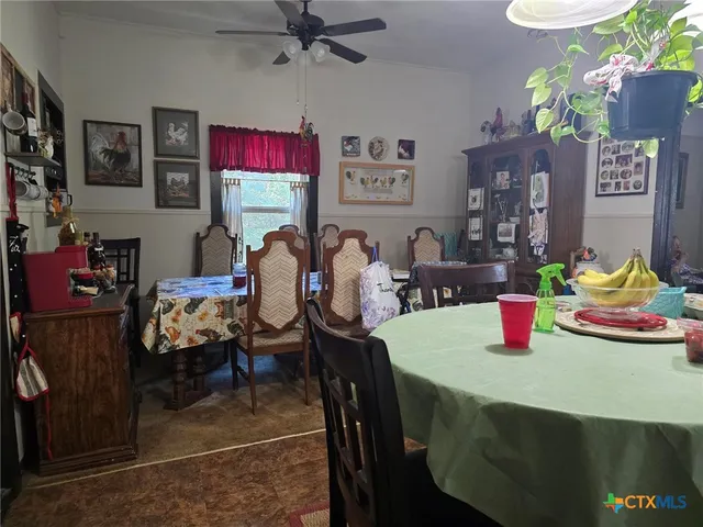a dining room with furniture and wooden floor