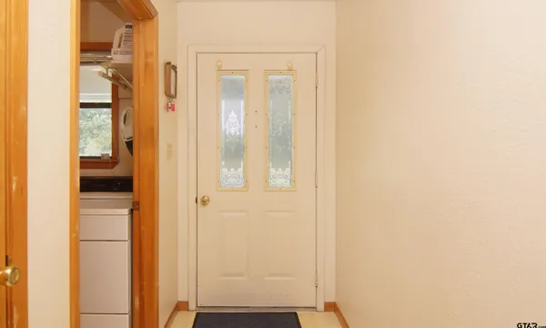 a view of a bathroom with a shower and a door