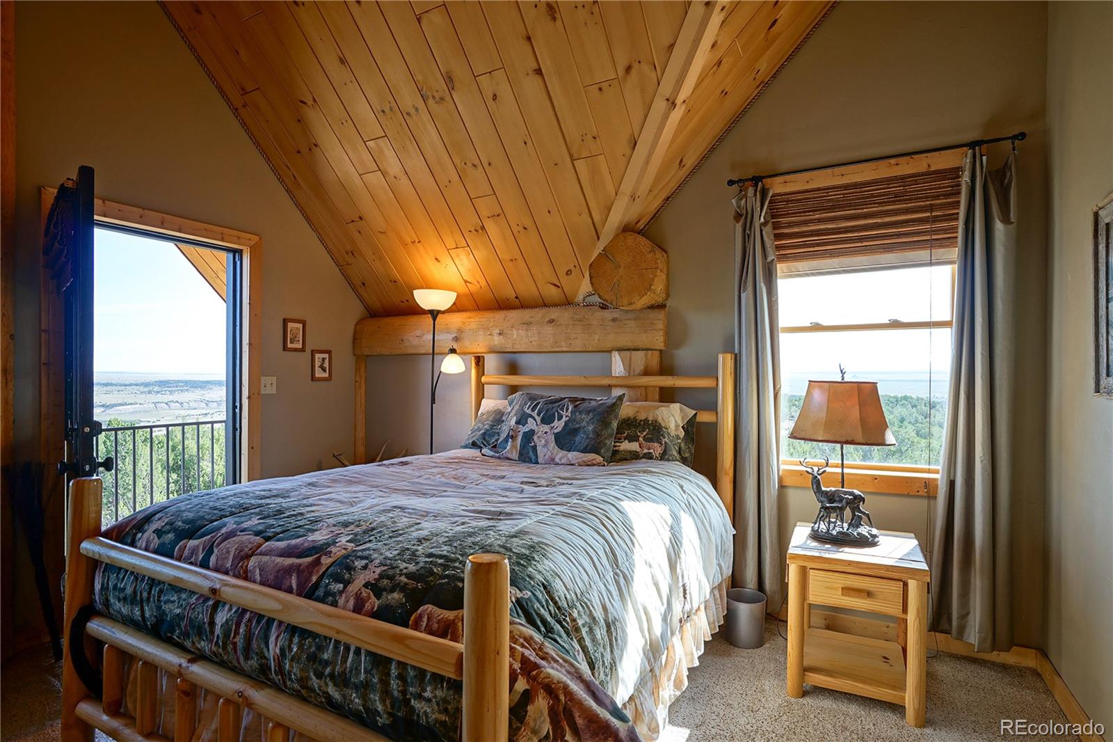 810 Mustang Road Rye, CO 81069 - Photo 31 of 50 a bed sitting in a bedroom next to a window