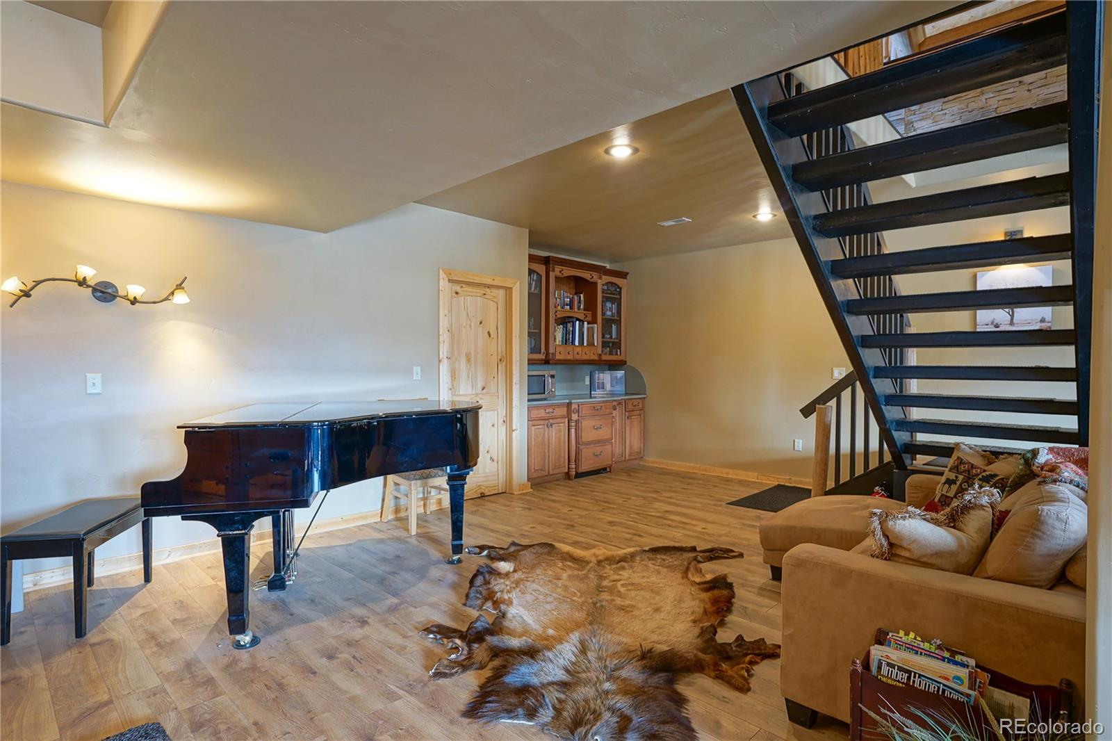 810 Mustang Road Rye, CO 81069 - Photo 35 of 50 a living room with furniture and a wooden floor