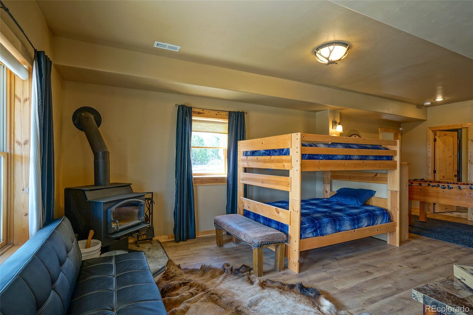 810 Mustang Road Rye, CO 81069 - Photo 38 of 50 a bedroom with furniture and a mirror