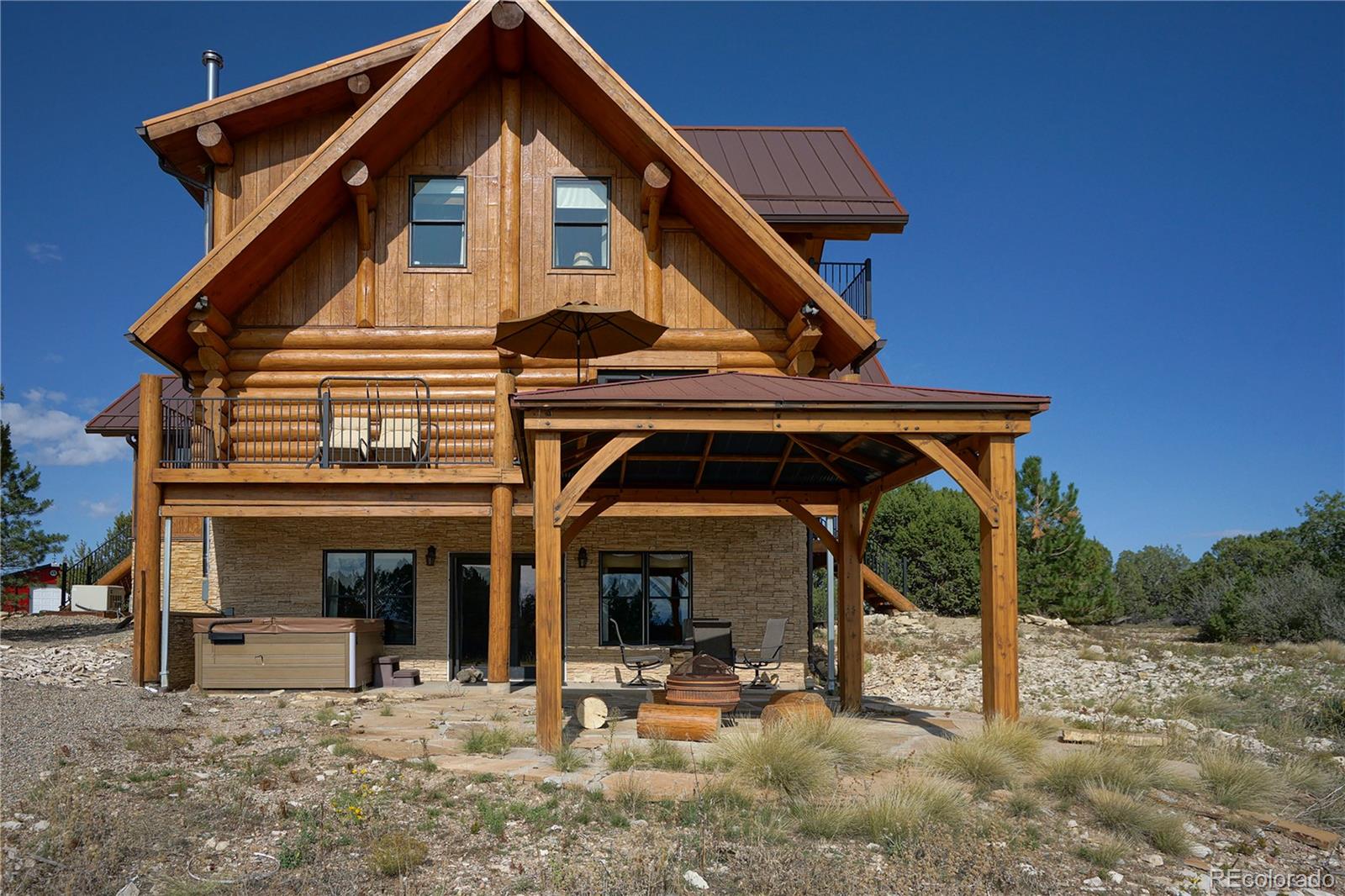 810 Mustang Road Rye, CO 81069 - Photo 46 of 50 a view of a house with table and chairs