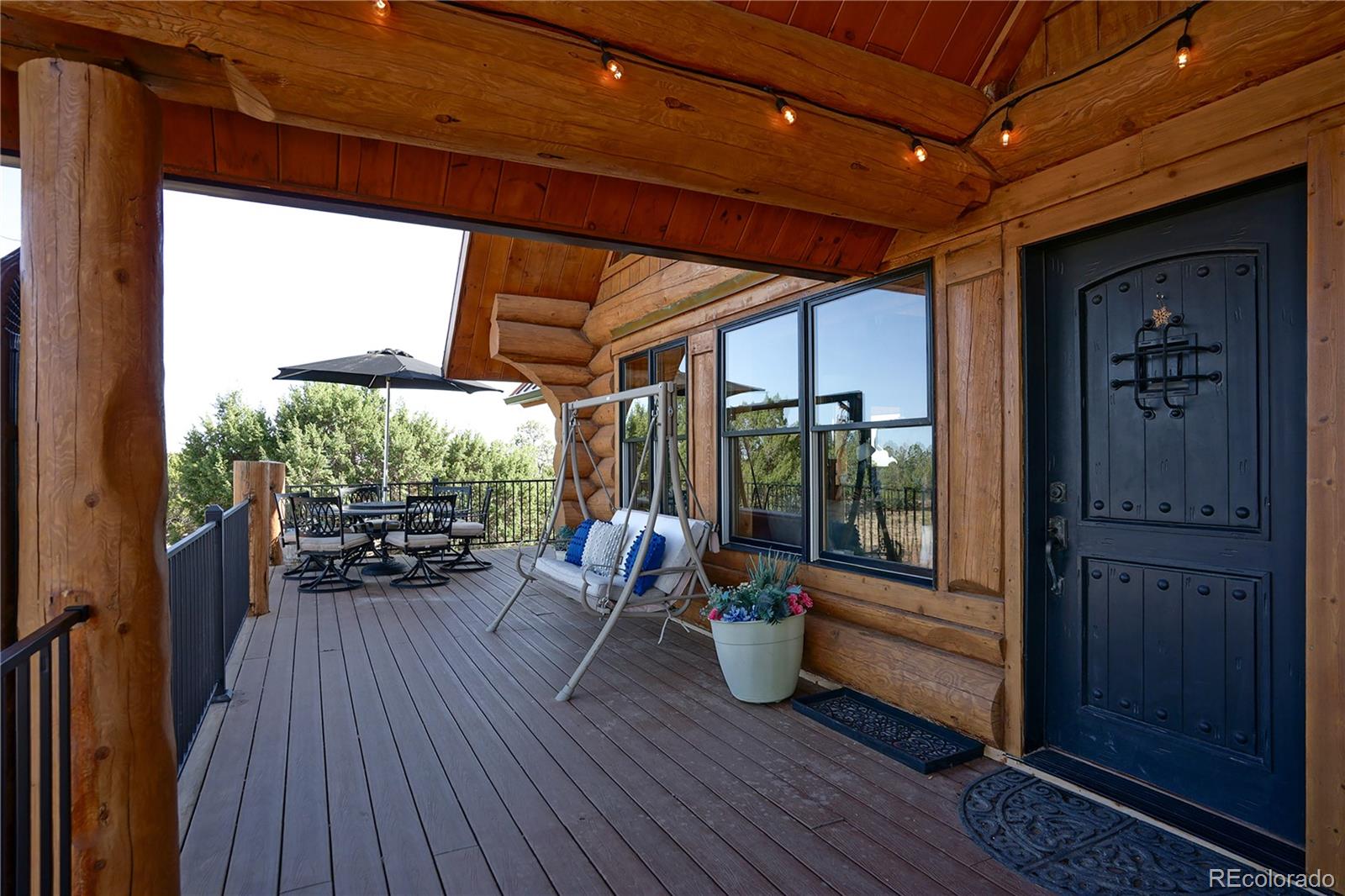 810 Mustang Road Rye, CO 81069 - Photo 9 of 50 a view of a porch with furniture and wooden floor