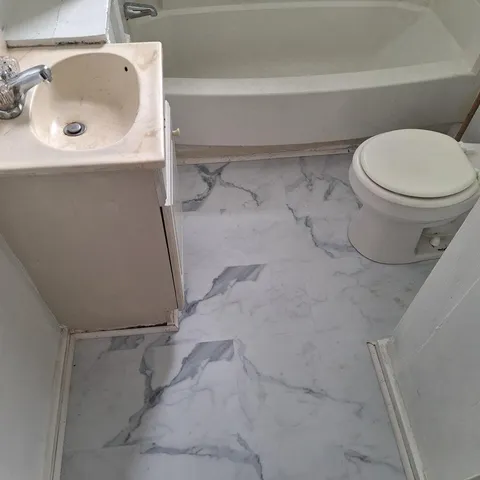a bathroom with a sink and a toilet