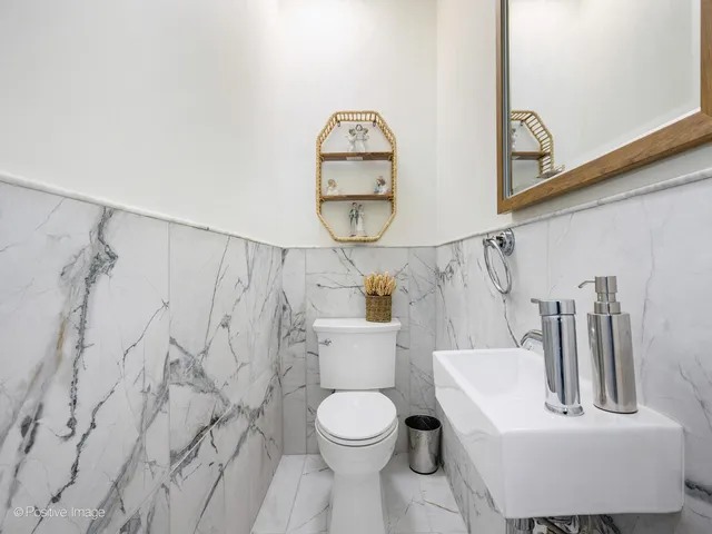 a bathroom with a toilet sink and tub