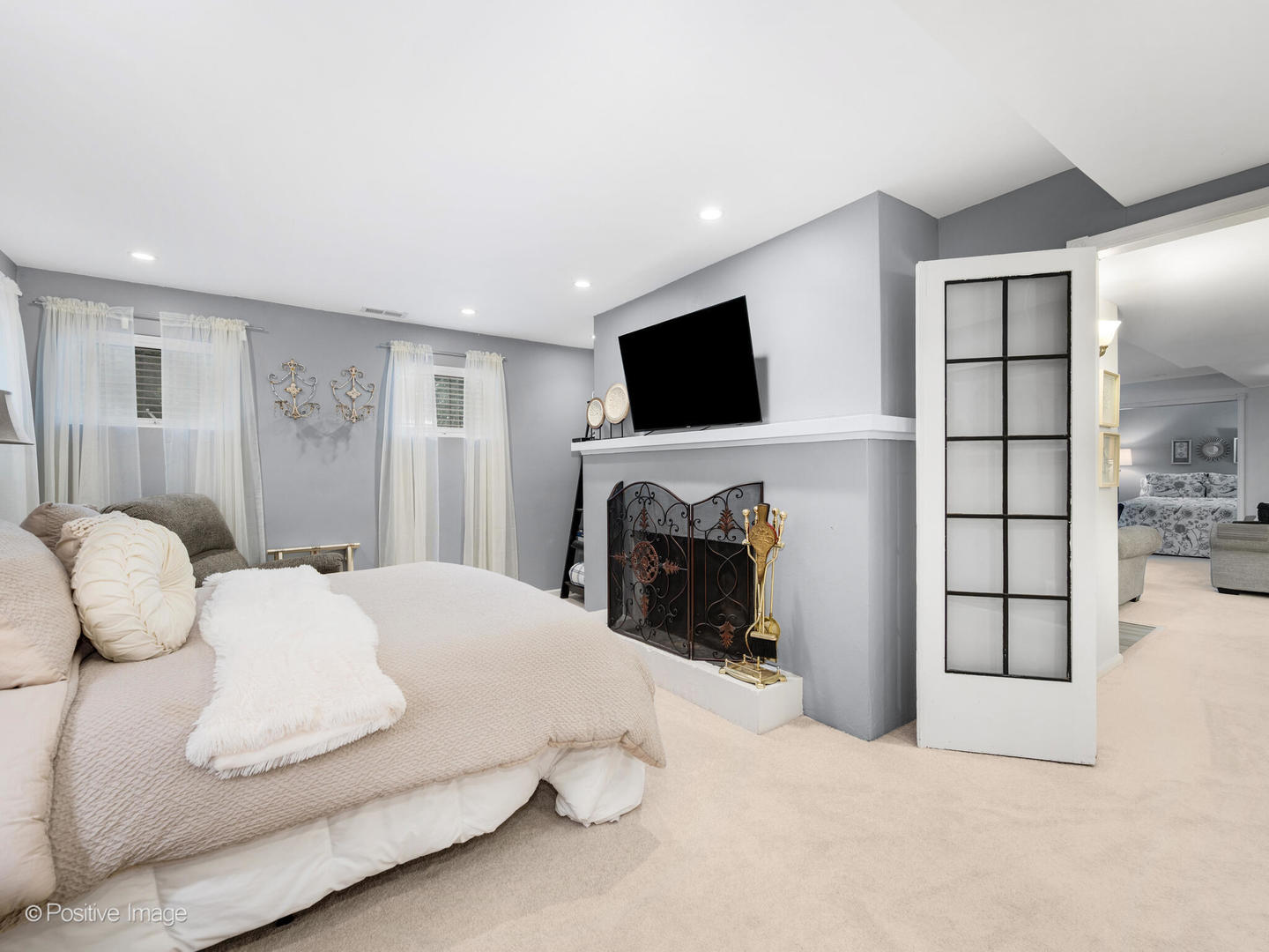 317 East Walnut Street Hinsdale, IL 60521 - Photo 19 of 38 a bedroom with a bed and a flat screen tv