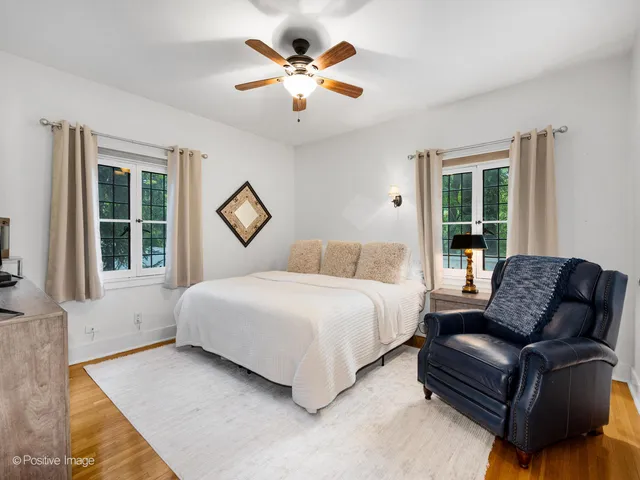 a bedroom with a bed couch and window