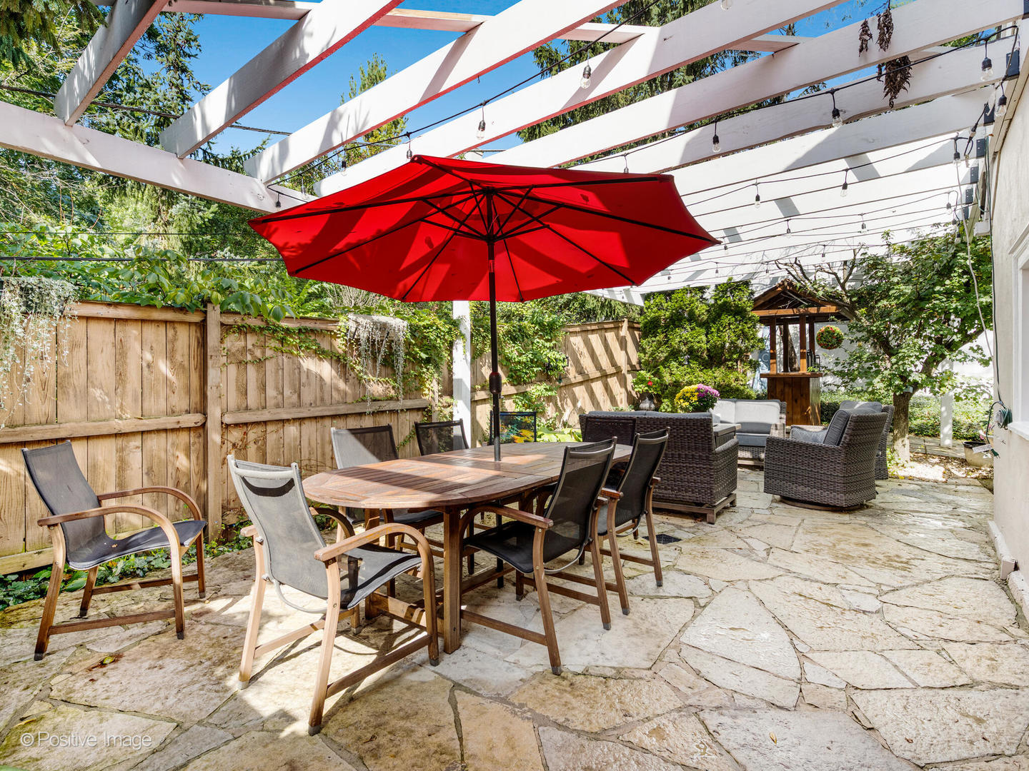 317 East Walnut Street Hinsdale, IL 60521 - Photo 32 of 38 a view of a patio with a table and chairs under an umbrella