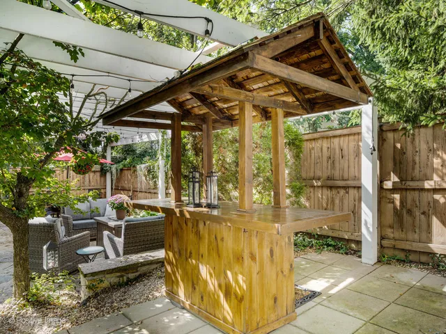 a view of a lounge chair and table in the patio