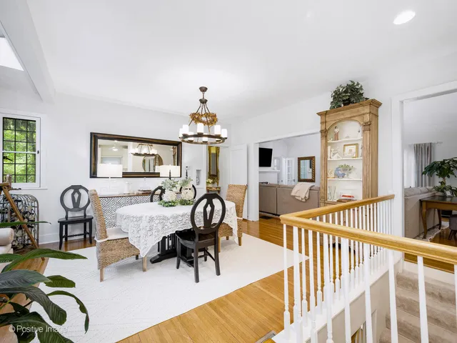 a view of a livingroom with furniture a dinning room and windows