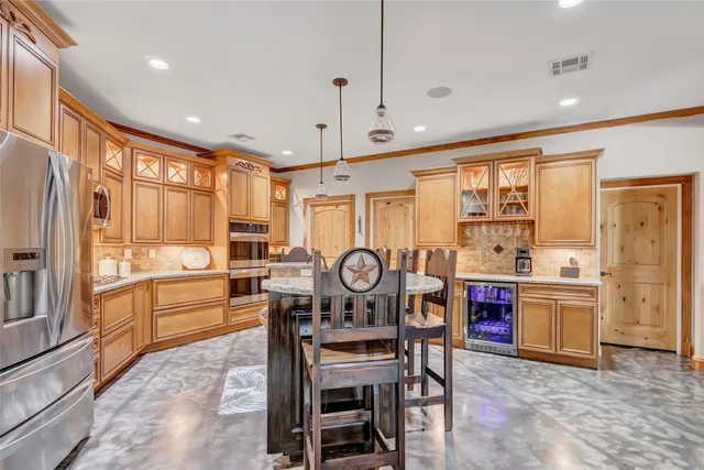 a view of a dining room with furniture a chandelier and wooden floor
