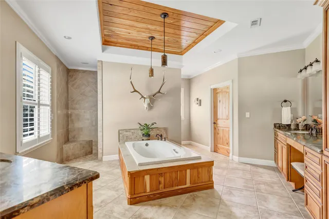 a large kitchen with kitchen island a sink stove and refrigerator