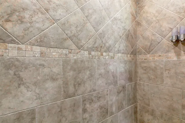 a bedroom with a bed couch and window