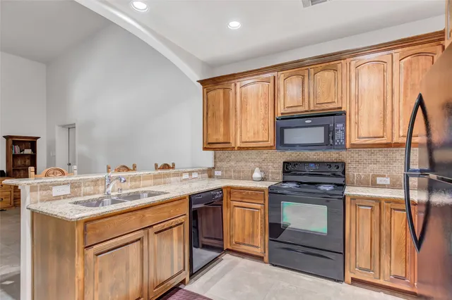 a bedroom with furniture and a chandelier