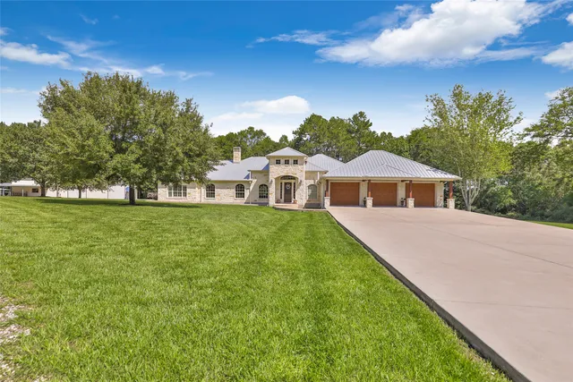 a front view of a house with outdoor seating