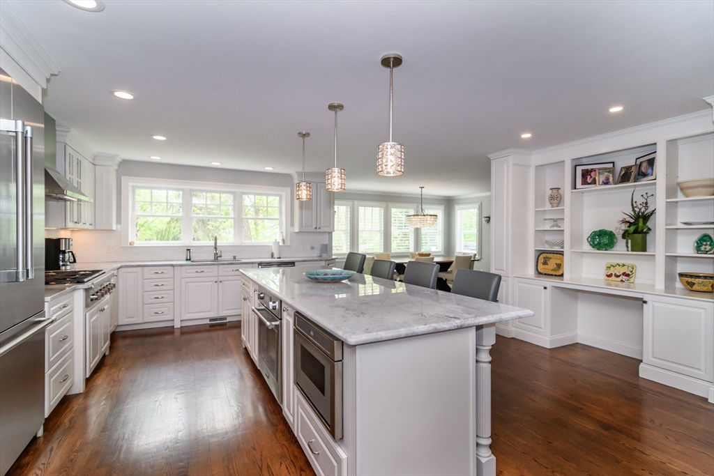 1098 Webster Street Needham, MA 02492 - Photo 3 of 21 a kitchen with stainless steel appliances granite countertop stove top oven and refrigerator