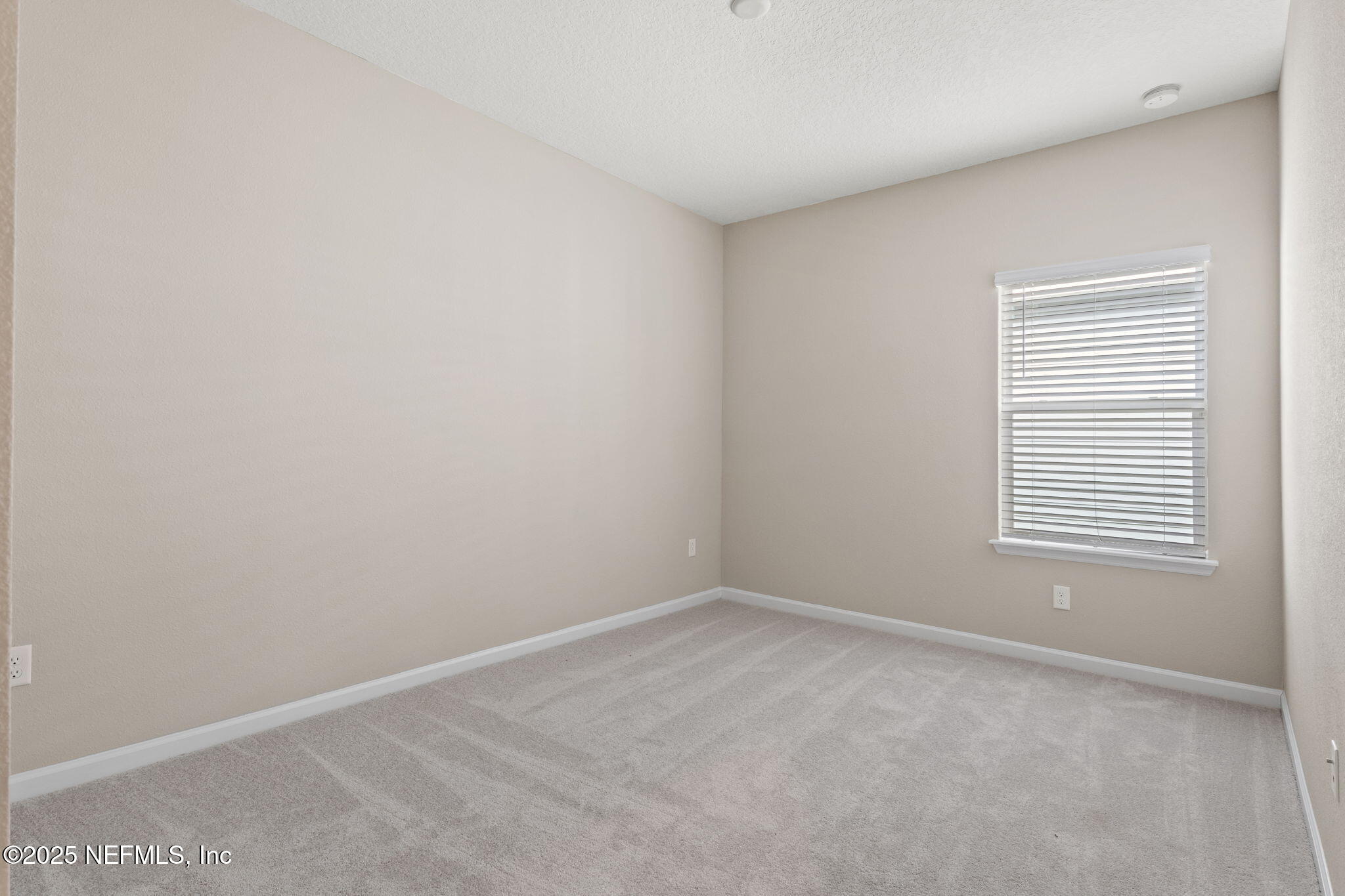 911 Colon Lane Jacksonville, FL 32218 - Photo 23 of 32 an empty room with a window