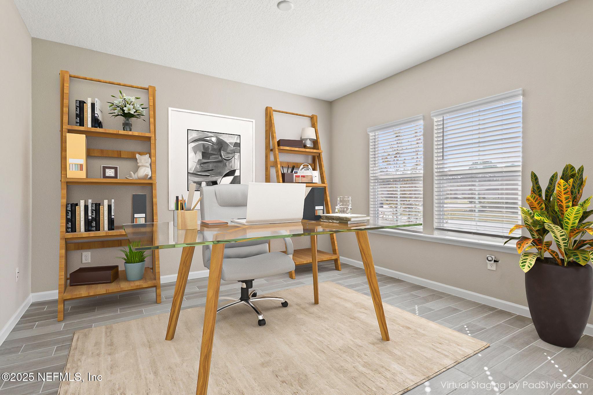 911 Colon Lane Jacksonville, FL 32218 - Photo 27 of 32 a living room with furniture and a potted plant