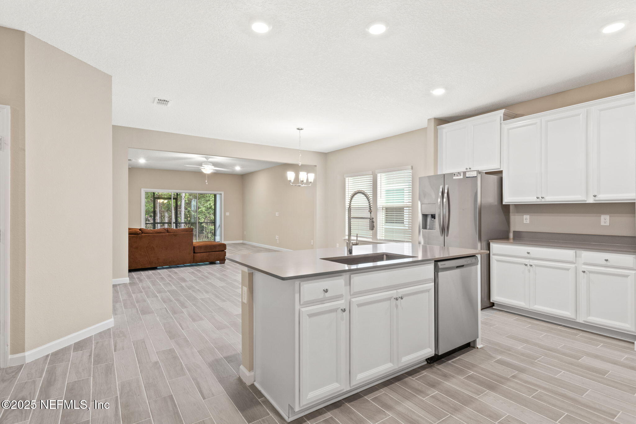 911 Colon Lane Jacksonville, FL 32218 - Photo 5 of 32 a kitchen with stainless steel appliances granite countertop a sink and cabinets
