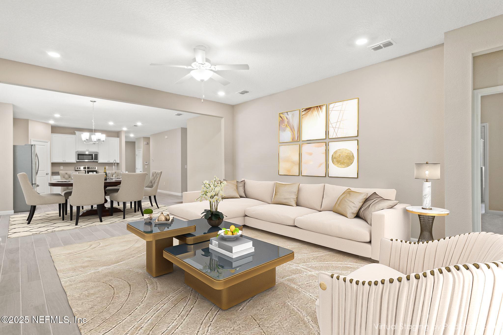 911 Colon Lane Jacksonville, FL 32218 - Photo 9 of 32 a living room with furniture and wooden floor