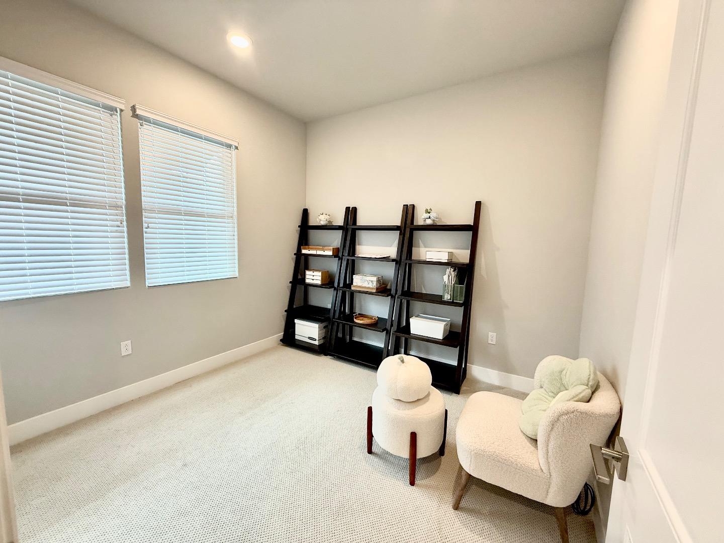1661 Spring Street, Unit 424 Davis, CA 95616 - Photo 16 of 34 a living room with furniture and a window