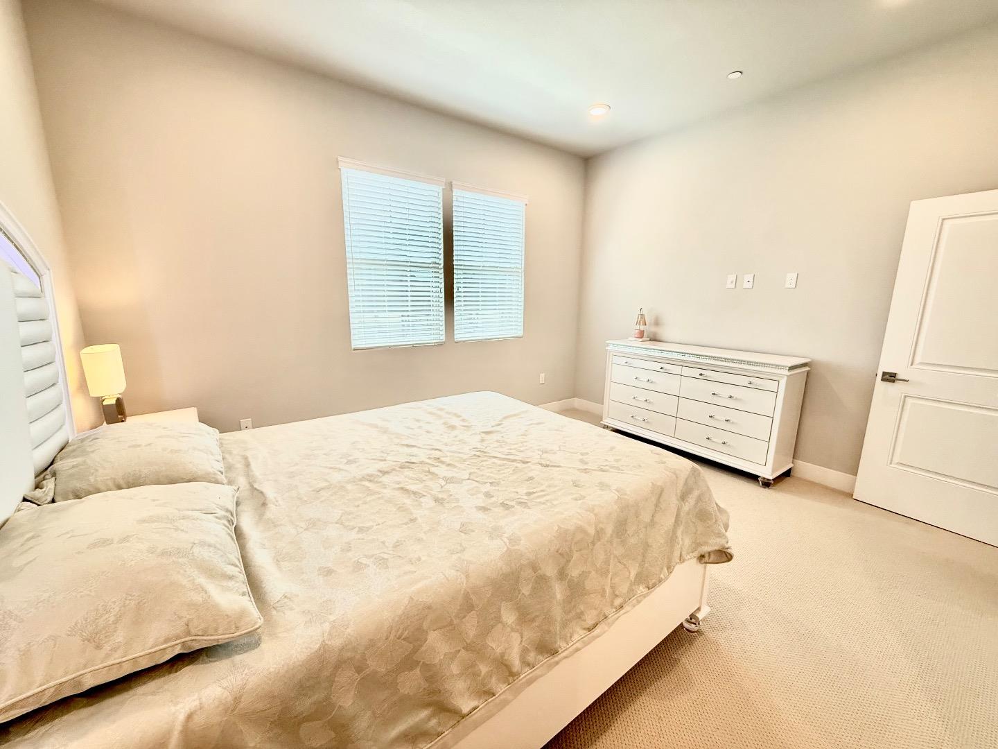 1661 Spring Street, Unit 424 Davis, CA 95616 - Photo 21 of 34 a bedroom with a bed and a window