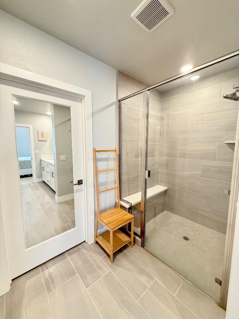 1661 Spring Street, Unit 424 Davis, CA 95616 - Photo 24 of 34 a living room with a bath tub and shower