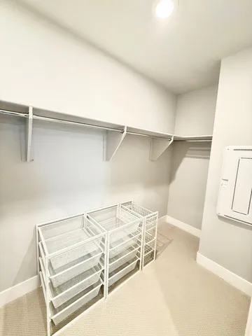 a view of an empty walk in closet