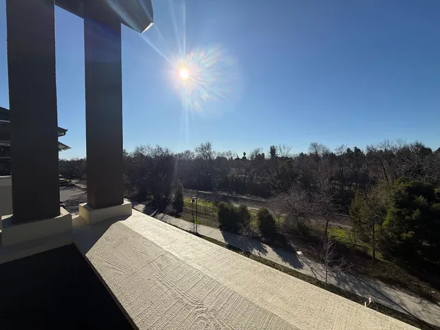 a view of balcony with furniture