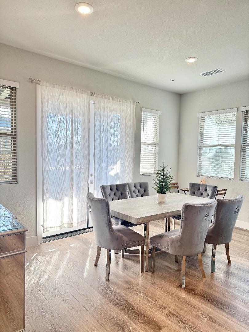 1661 Spring Street, Unit 424 Davis, CA 95616 - Photo 4 of 34 a view of a dining room with furniture and window