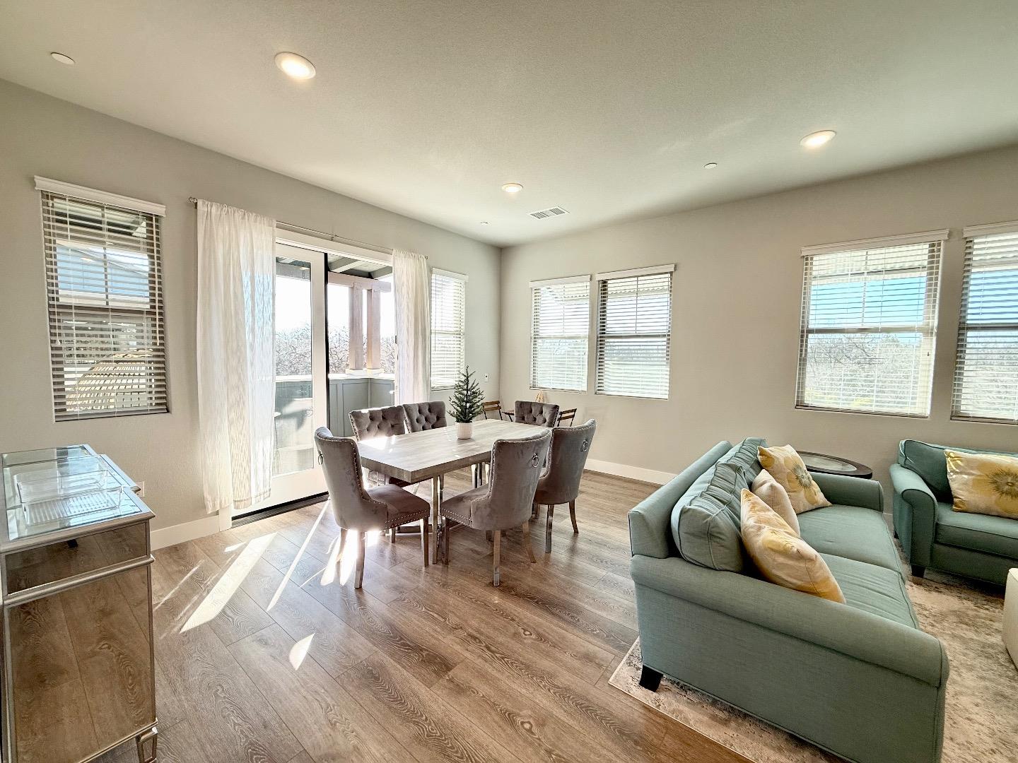 1661 Spring Street, Unit 424 Davis, CA 95616 - Photo 6 of 34 a living room with furniture wooden floor and a window
