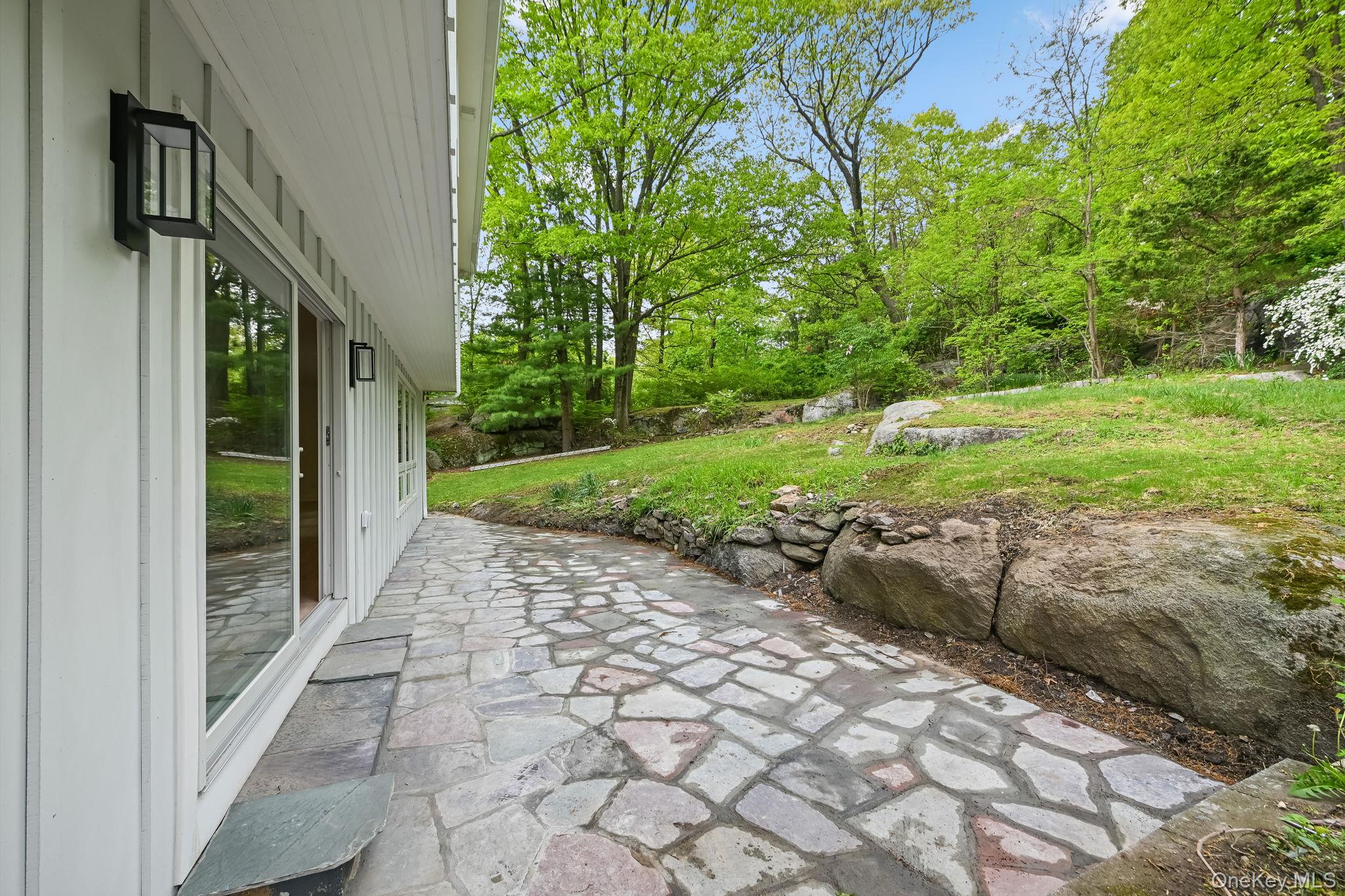 24 Country Road Mamaroneck, NY 10543 - Photo 30 of 37 a view of a pathway both side of house