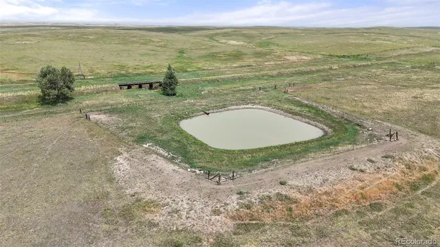 a view of a lake with a yard