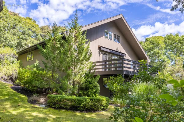 a backyard of a house with lots of green space