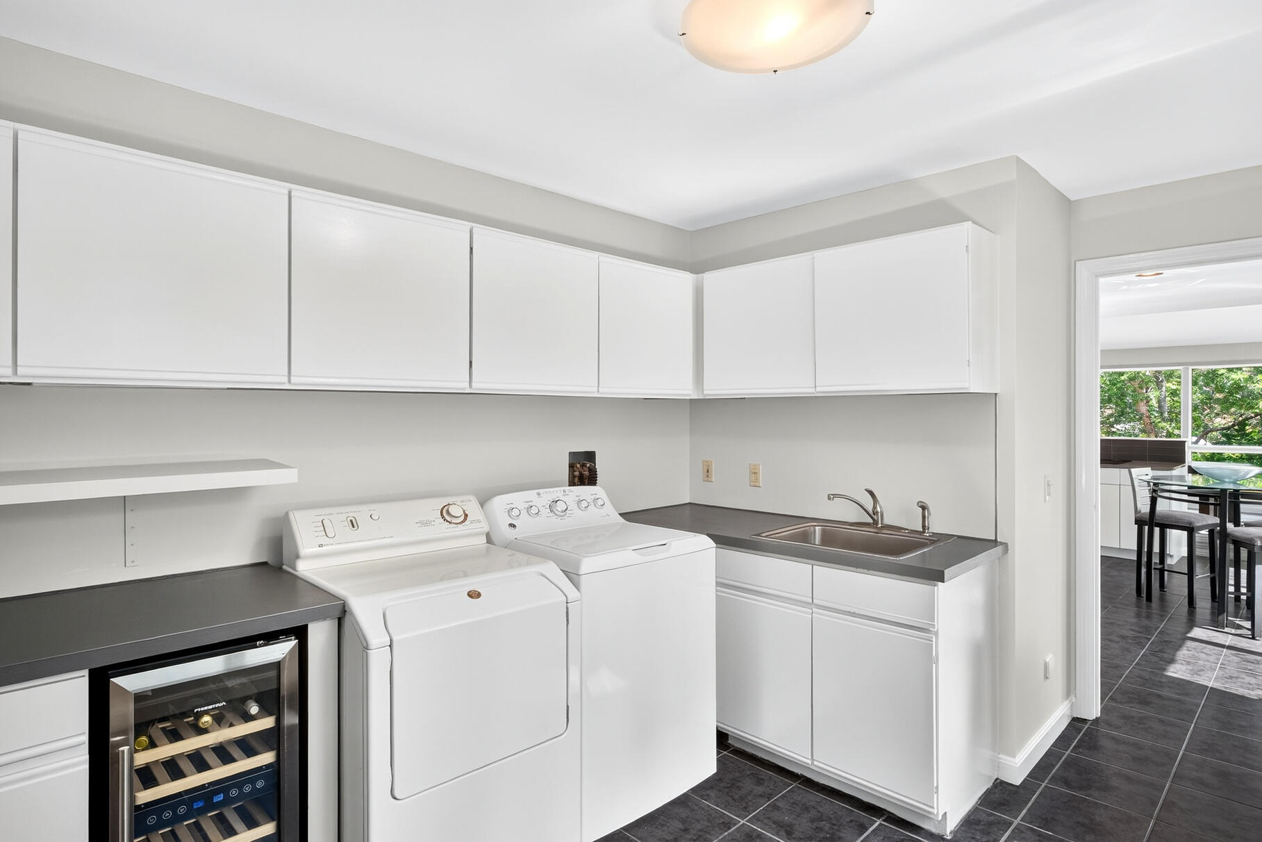 7 Fishermans Road Truro, MA 02666 - Photo 18 of 42 a utility room with sink dryer and washer