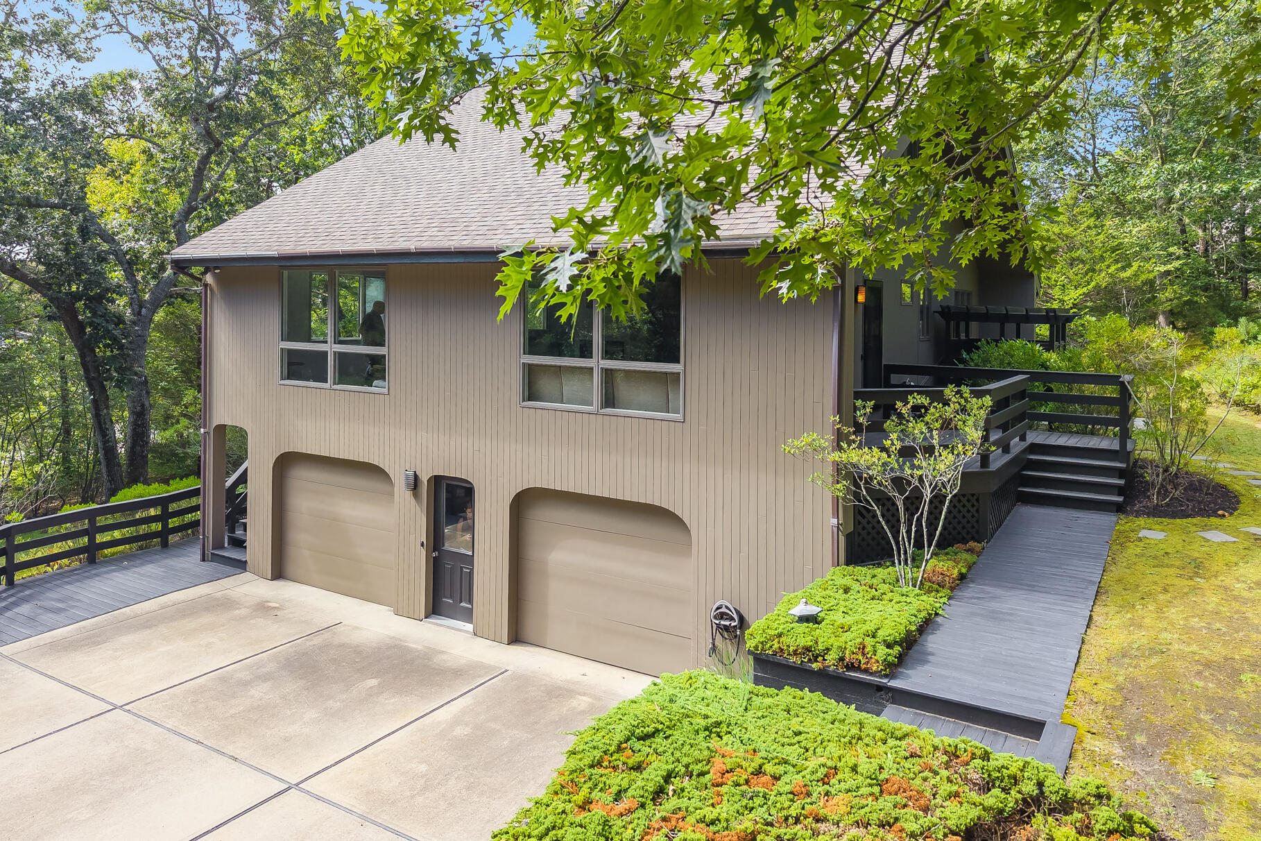 7 Fishermans Road Truro, MA 02666 - Photo 2 of 42 a front view of a house with a yard