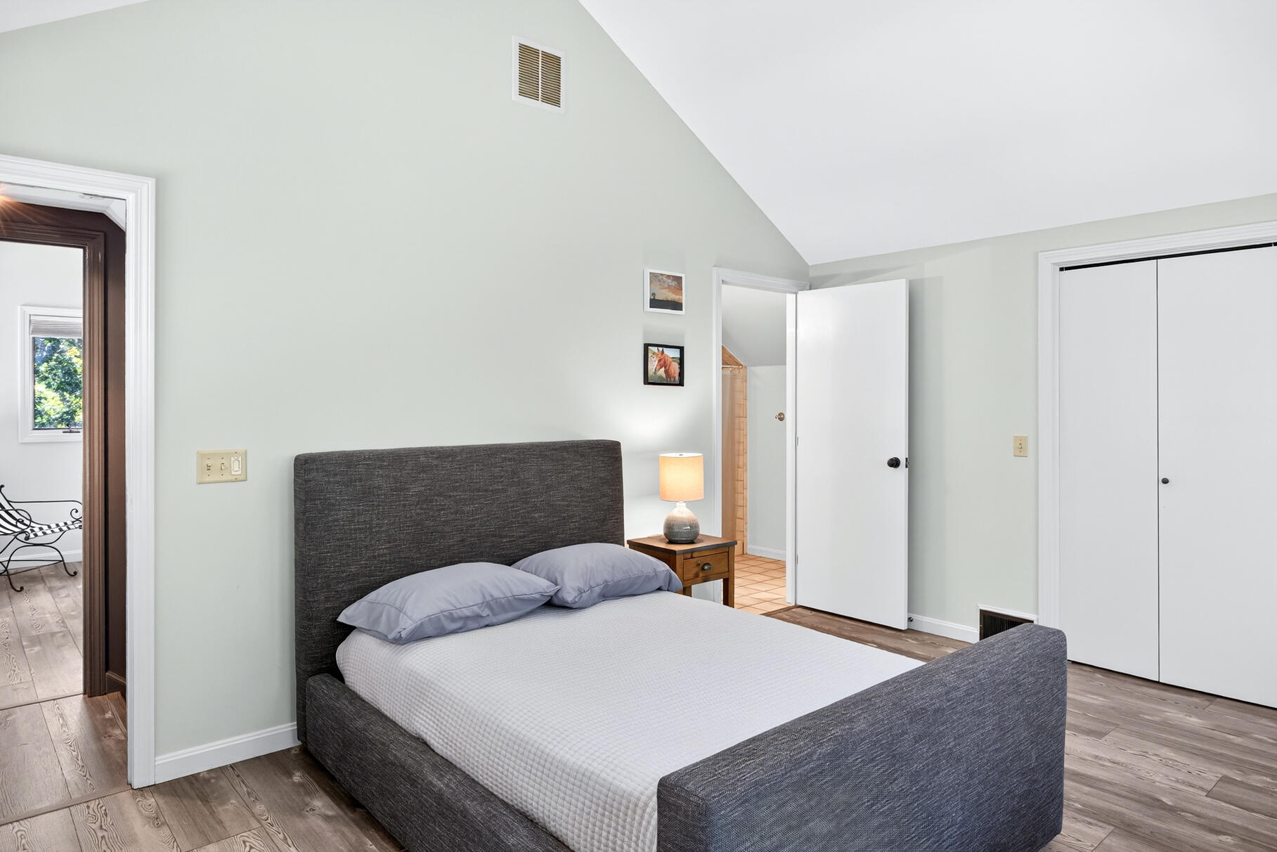 7 Fishermans Road Truro, MA 02666 - Photo 26 of 42 a bedroom with a bed and wooden floor