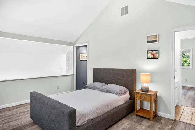 a bedroom with a bed and window