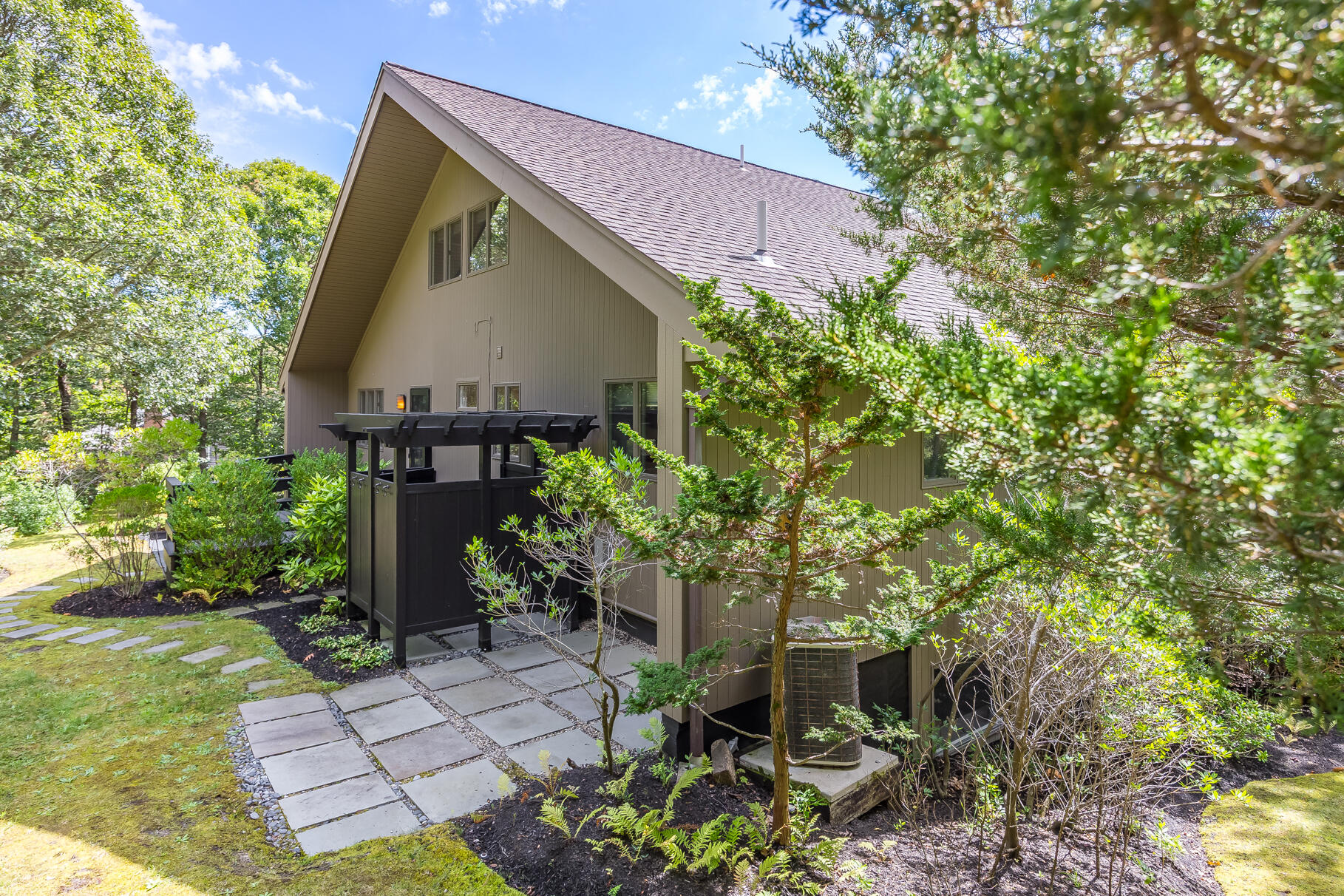 7 Fishermans Road Truro, MA 02666 - Photo 31 of 42 a view of a house with backyard and sitting area