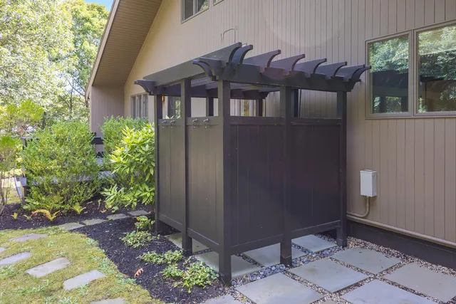 a view of a patio with table and chairs and potted plants